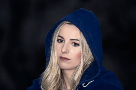 Serenade of Solitude: Stunning Image of a Beautiful, Sad Blonde Woman Embracing Her Emotionsの写真素材