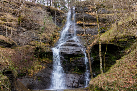 Serenity Unveiled at the Majestic Uguna Waterfall in Nature's Embraceの写真素材