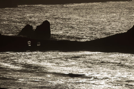 San Juan's Iconic Cliff Embraced by Coastal Sunset Beautyの写真素材