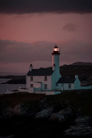 Twilight Sentinel: Serene Lighthouse Silhouetted Against the Coastal Sunset, Guiding Ships with Majestic Charm.の素材