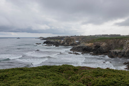 Tranquil Coastal Beauty: Overcast Winter Scene in Asturias with Dramatic Cliffsの写真素材