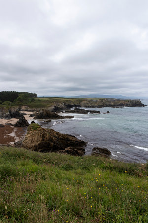 Majestic Rocky Shores of Asturias: Moody Winter Day Along the Rugged Coastal Landscapeの写真素材