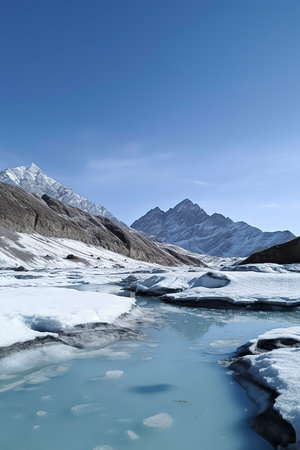 Breathtaking Snow-Capped Peaks: Exploring the Serene Alpine Landscape by the Crystal Lakeの素材