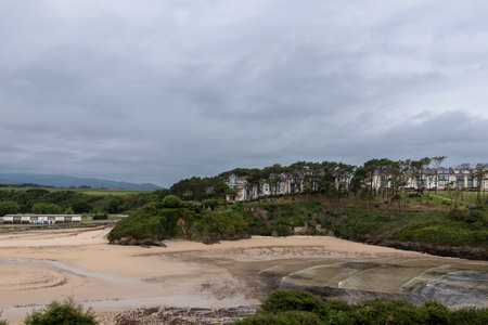 beach on the coast of Asturias on a cloudy summer dayの写真素材