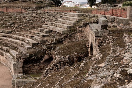 Stone steps and supporting walls of the tiered seating of the ruined roman theatre in medellin, spainの写真素材
