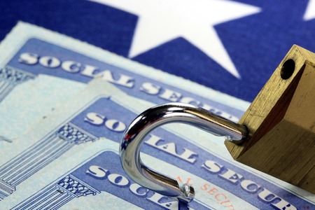 Padlock and social security card - Identity theft and identity protection concept