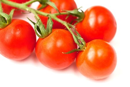 Cherry tomatos over white backgroundの写真素材