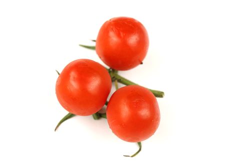 Cherry tomatos over white backgroundの写真素材
