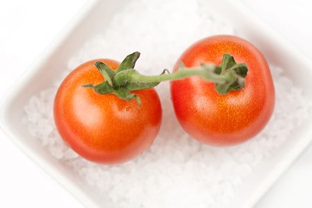 Cherry tomato on the sea salt の写真素材