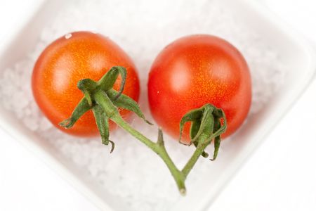 Cherry tomato on the sea salt の写真素材
