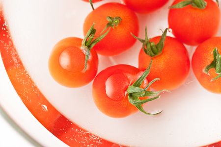 Cherry tomato on the waterの写真素材