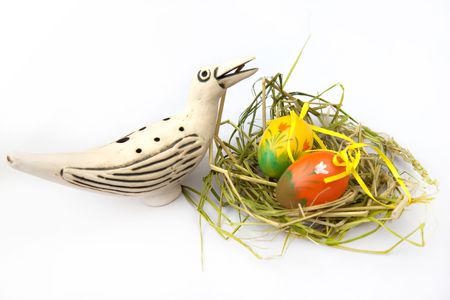 Painted orange Easter Egg with a birdの写真素材