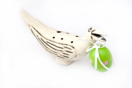 Painted Green Easter Eggs in bird's billの写真素材