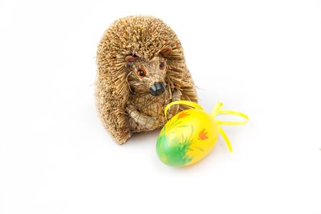 Painted yellow Easter Egg with a hedgehogの写真素材