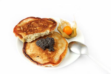 Tow freshly prepared pancakes with poppy souseの写真素材