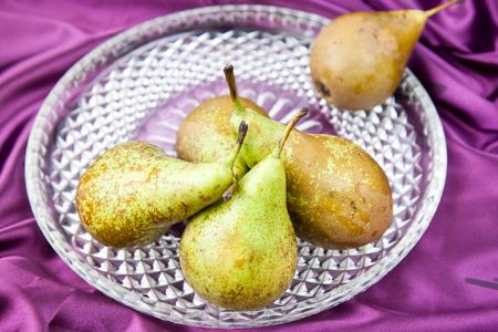 pears fresh on a violet silk
