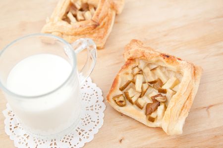 Fresh baked cakes with cup of a milkの写真素材