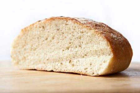 white bread loaf over white backgroundの写真素材