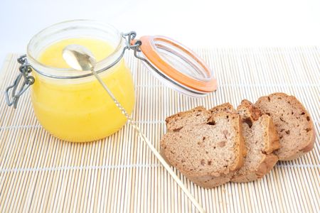 brown sliced homemade bread with yellow cream の写真素材