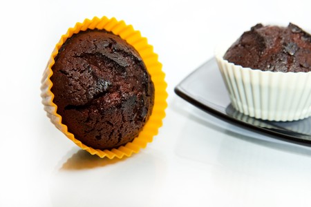 tow chocolate muffins isolated on white background の写真素材