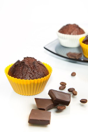 chocolate muffins with coffee beans and chocolate の写真素材