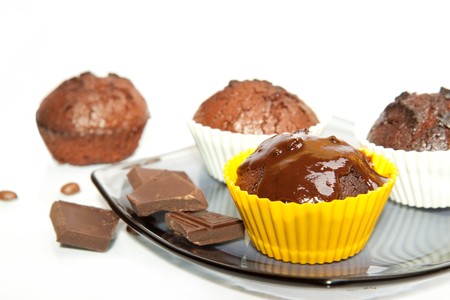 chocolate muffins with coffee beans and chocolate の写真素材