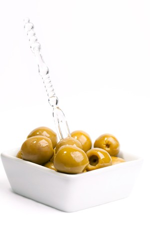 Green olives on a white backgruond の写真素材