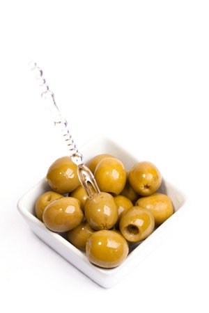 Green olives on a white backgroundの写真素材
