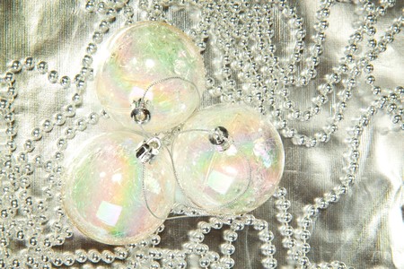Transparent christmas balls on a silver beadsの写真素材