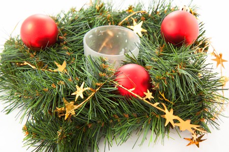 Christmas wreaths with christmas toys on the white backgroundの写真素材