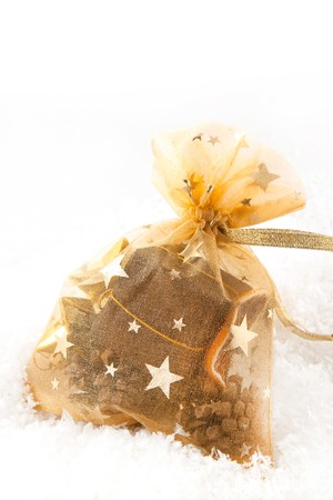 Golden christmas sack with the gifts on the white backgroundの写真素材