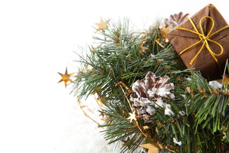 Christmas wreaths with christmas gift and stars on the white backgroundの写真素材