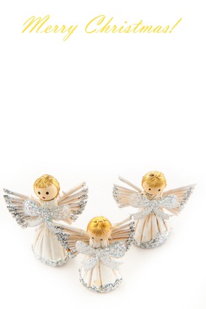 Three shining christmas angel figurines on white background の写真素材