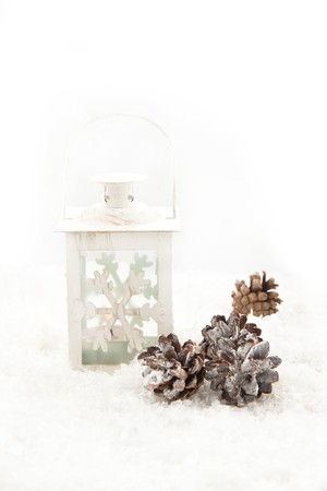 White christmas lightning latern on a snowの写真素材
