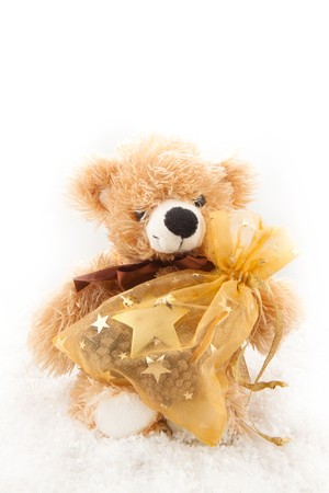Teddy-bear with christmas gifts on the white backgroundの写真素材
