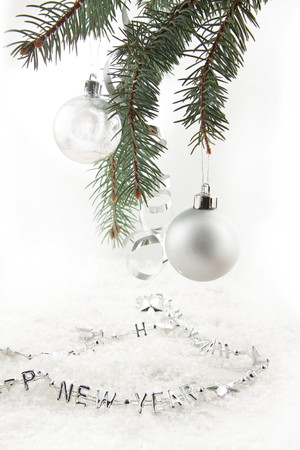 Silver christmas balls with on the christmas tree on a white backgroundの写真素材