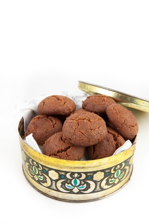 Chocolate cookies in the old golden potの写真素材