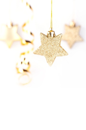 Golden christmas stars on the white backgroundの写真素材