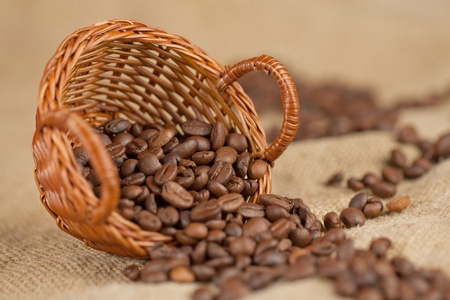 Fragrant fried coffee beans on the little basketの写真素材