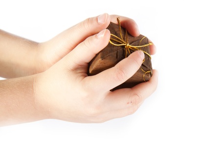 Christmas gift in the boy's hands on the white backgroundの写真素材