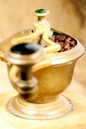 Fragrant fried coffee beans in the old coffee grinderの写真素材