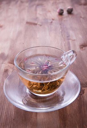 Transparent cup of green tea on the wooden tableの写真素材