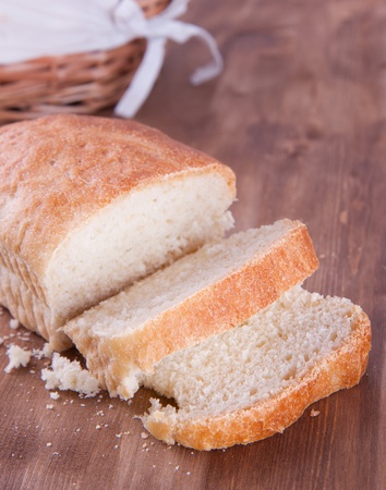 Sliced fresh cooking bread on the wooden tableの写真素材