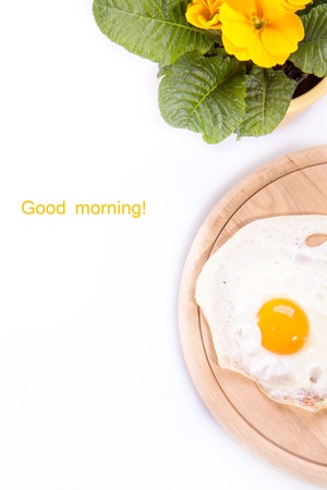 Fried egg on a wooden deskの写真素材