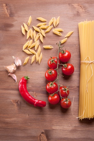 Composition of tow kind of pasta, pepper, onion and tomatoの写真素材