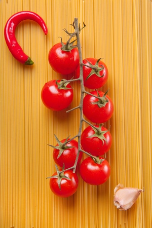 Composition of pasta, pepper, onion and tomatoの写真素材