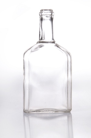 Old fashioned glass bottle over whiteの写真素材