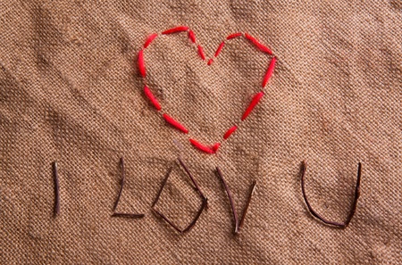 Heart from thread on the sacking. Composition for themes like love, valentine's dayの写真素材