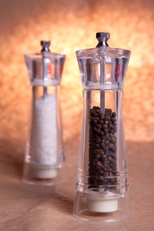 Salt and pepper grinders. Focus on pepper.の写真素材