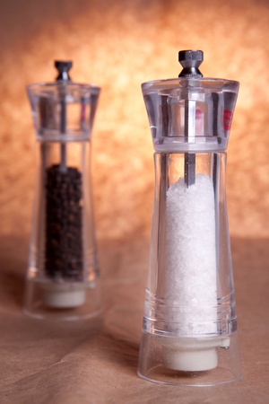 Salt and pepper grinders. Focus on salt.の写真素材